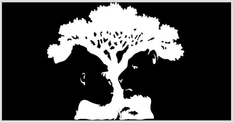 An optical illusion featuring a tree with the faces of a child and a lion formed by its branches and leaves.