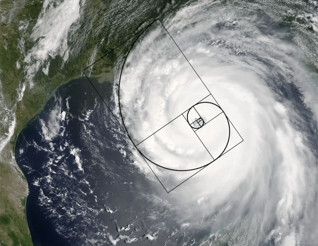 A satellite image of a hurricane over the ocean, with the Fibonacci spiral superimposed to illustrate the presence of the Golden Ratio in nature.