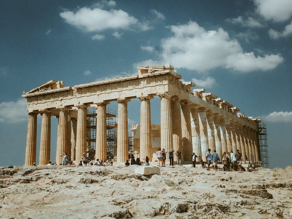 The Parthenon in Athens, an ancient temple dedicated to the goddess Athena, showcasing its iconic columns and architectural beauty under a clear blue sky.