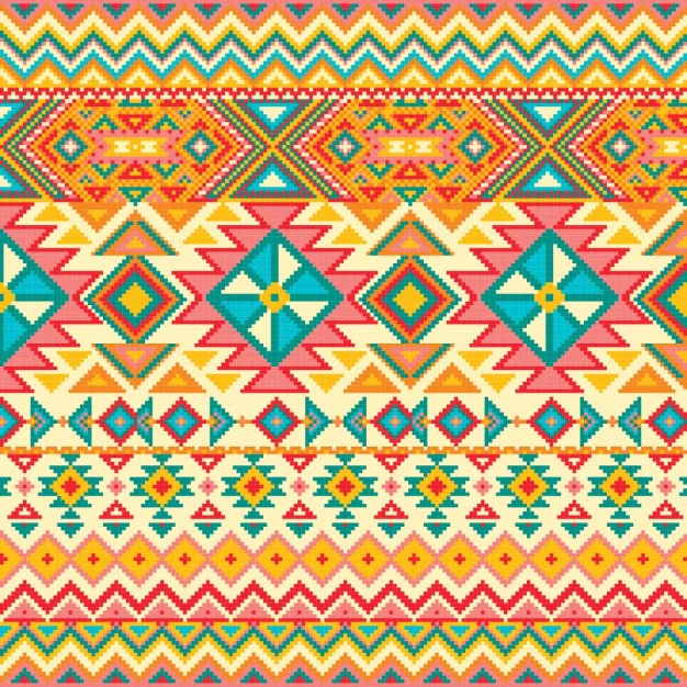 Colorful geometric pattern featuring vibrant diamonds, triangles, and zigzag designs in a repeating arrangement.