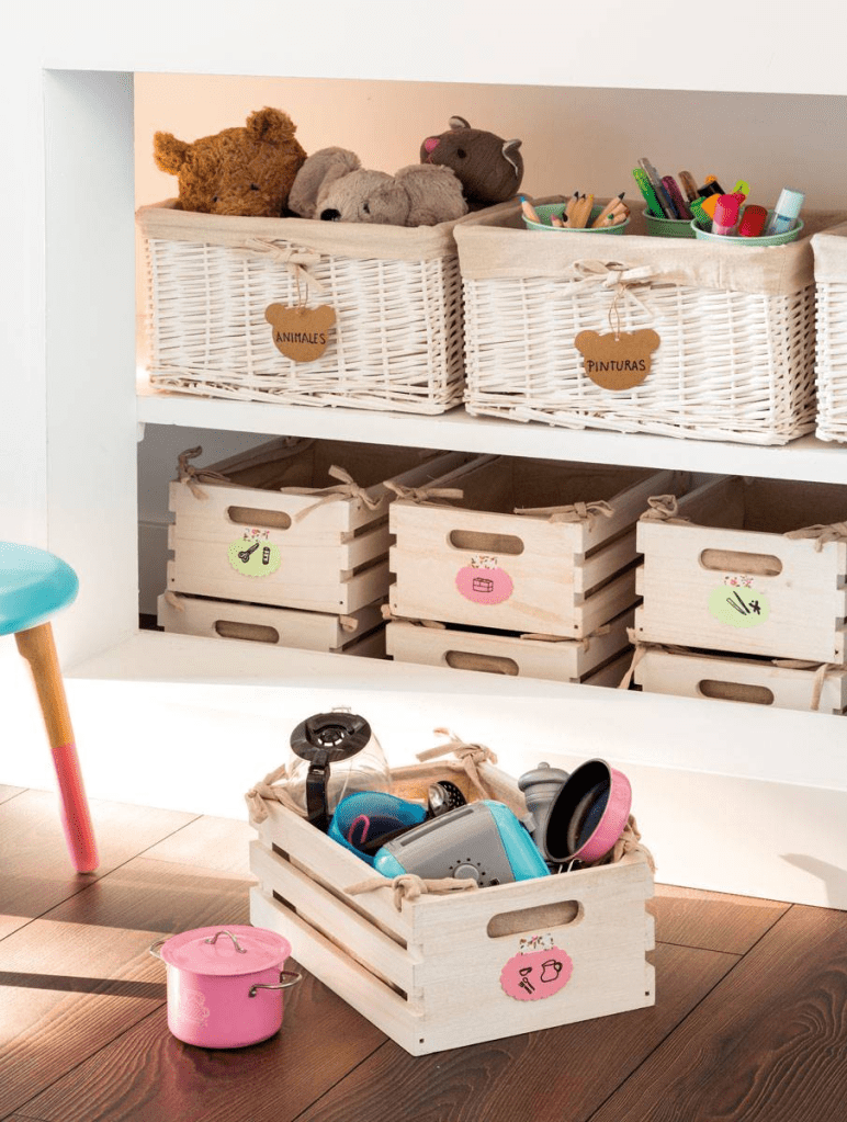 A well-organized shelf with wicker baskets labeled for storage; some baskets contain toys, while others hold craft supplies, illustrating effective organization strategies.